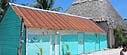 Wooden houses painted in lively colors in Isla Holbox